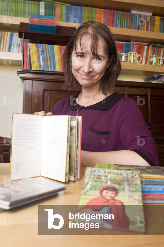Helen Day from Harpenden with some of her collection of Ladybird books including the first she signed as a four year old, the collection spans from the 1960s up to 1984 and covers all the languages the books have been printed in.