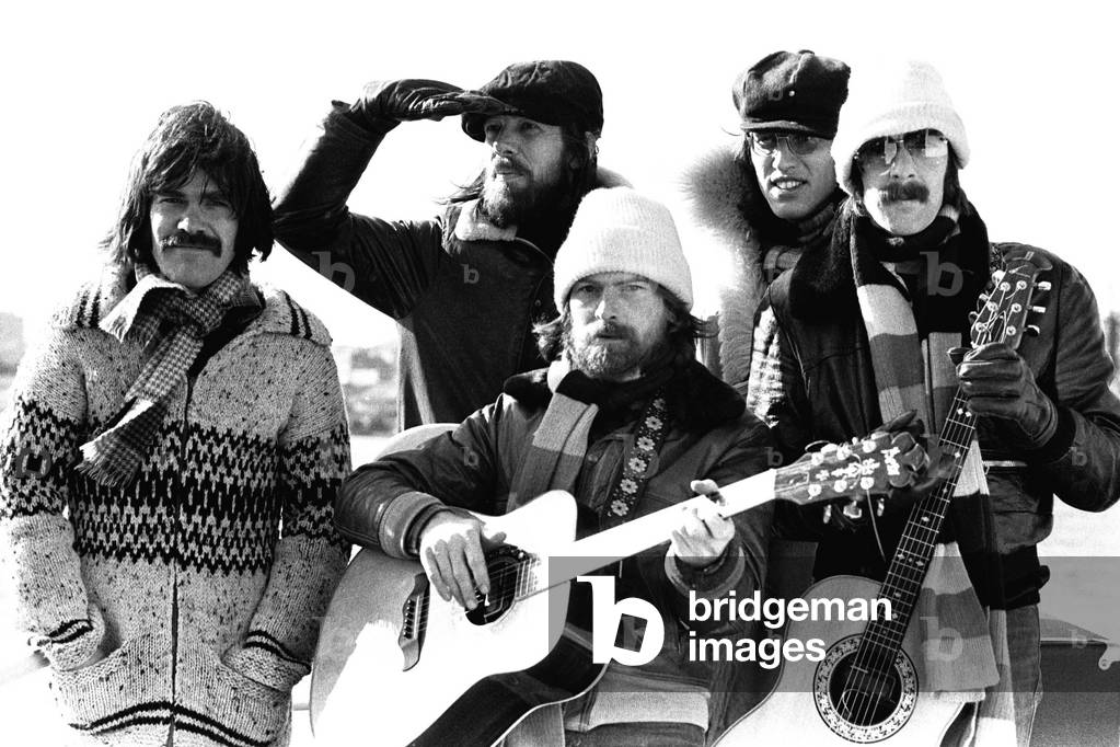 Lindisfarne sailed down the Tyne on a musical journey. The group were filming on board a Tyne ferry for a half-hour television show called 'All Right Now'. (Left to right) Ray Jackson, Rod Clements, Si Cowe, Ray Laidler and Alan Hull 4th March, 1979 (b/w photo)