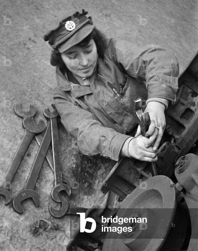 World War II Women: She was a waitress and dished out knives and forks. Now look at the big spanner she uses in her war effort. This is Miss Edith Care, of Evesham, Photographed at ATS Western Command Ordinance Factory. November 1942