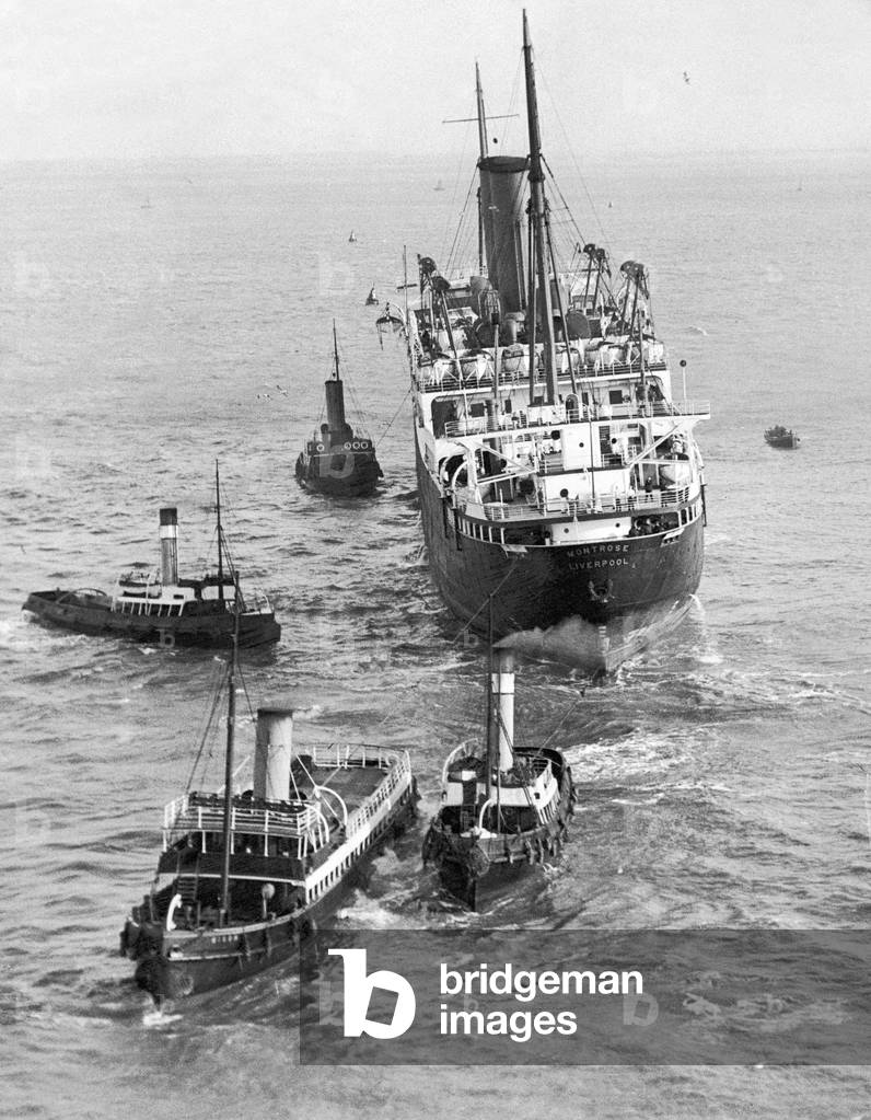 The Liner 'Montrose' and the tugs which were sent to re-float her in the Mersey.
20th February 1933