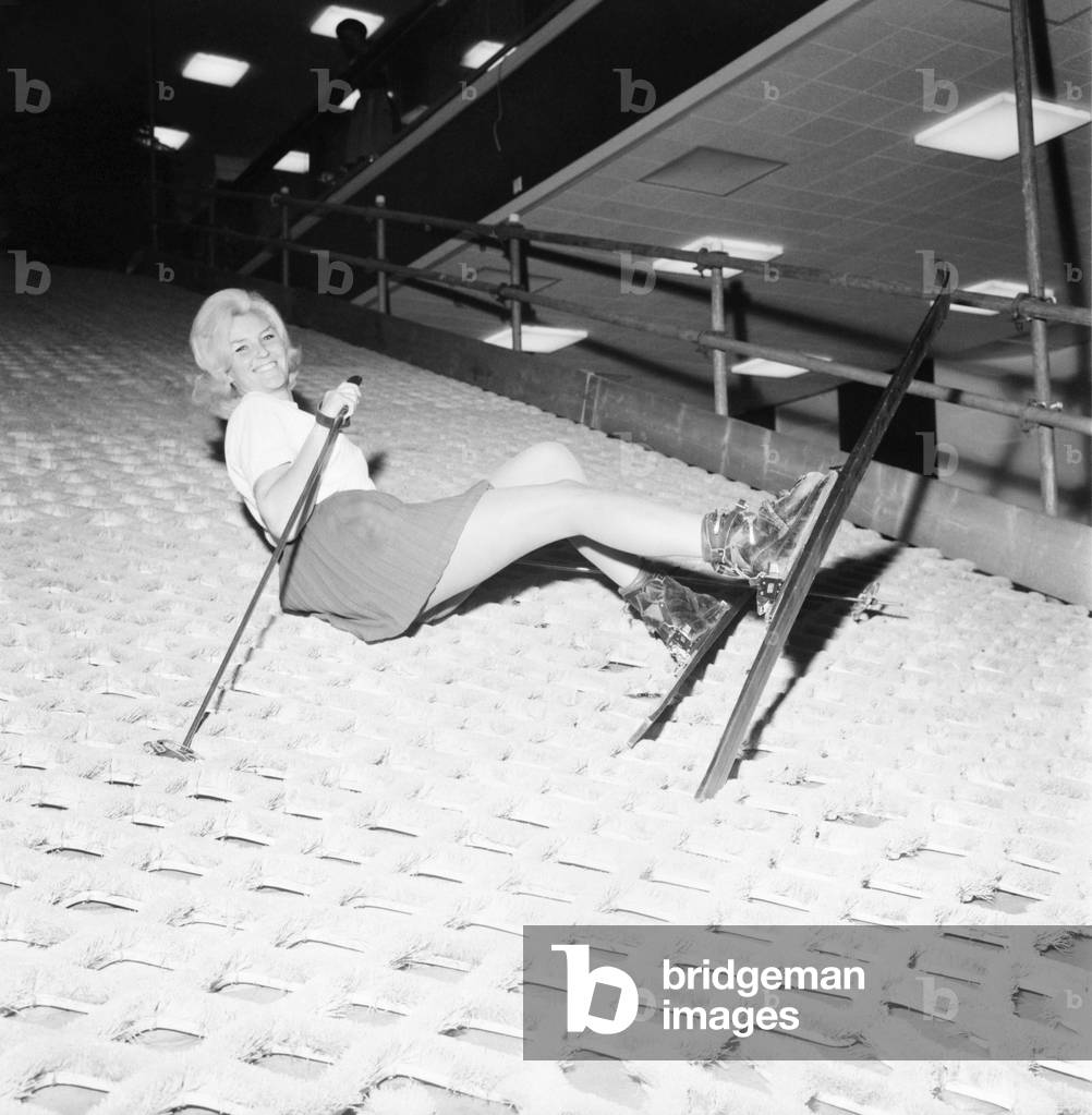 Winter's first snows have been no help when it comes to mastering the arts of ski-ing. Even though she was on an indoor slope, Miss Maureen Beech came a purler when she tried her luck on a huge indoor ski slope at a holiday and travel exhibition in Brighton. 
December 1969