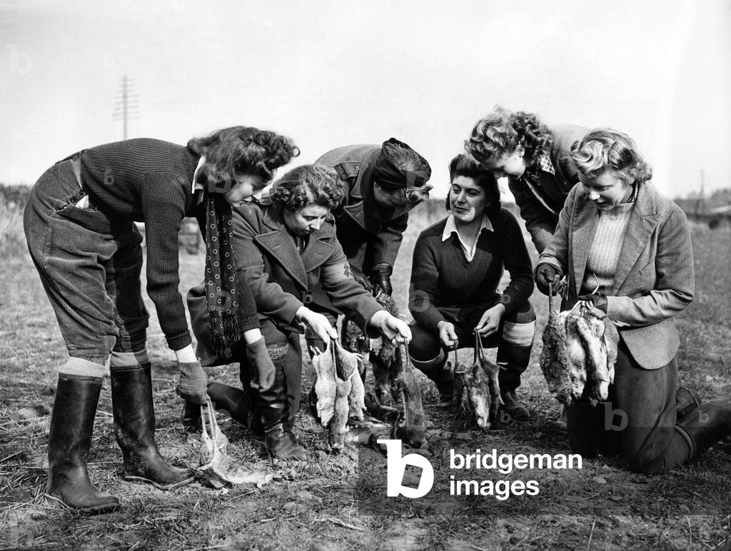 Girls of the Womens' Land Army (Pests Department) are emplyed in S. Wales as rat catchers. Girls counting the days 