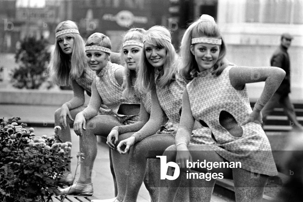 Girls are pictured modelling the usherettes dress of the future designed especially for them by Uniformula of London, a company who make and design uniforms for the Hotel and Cinema trade, October 1969 (b/w photo)
