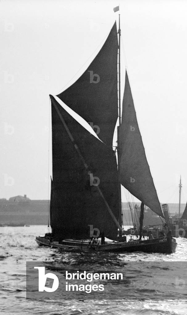 A traditional Thames barge seen here in the Lower Thames estuary, c.1935 (b/w photo)