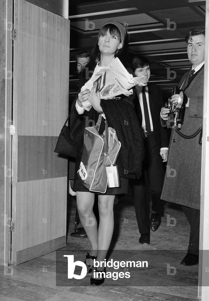 Chrissie Shrimpton, girlfriend of Mick Jagger of The Rolling Stones, flying out to join him at the end of their US tour.
4th December 1965