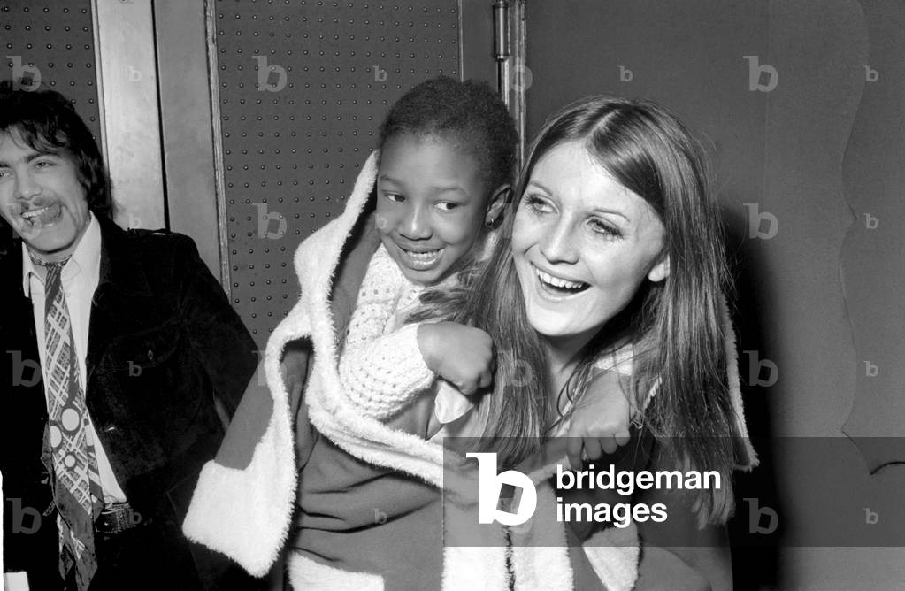 A Christmas party for the children of the staff of The Talk of the Town and The Carousel. Guests of honour were 16 children from The Moral Welfare Association, and 16 children from The Dockland Settlement. The party was arranged by the Variety Club of Gt. Britain. 
Sandie Shaw as Mother Christmas with 5 year old Biafran girl Chinyere Mgbenwehn, who has brothers and sisters still in Biafra. 
December 1969