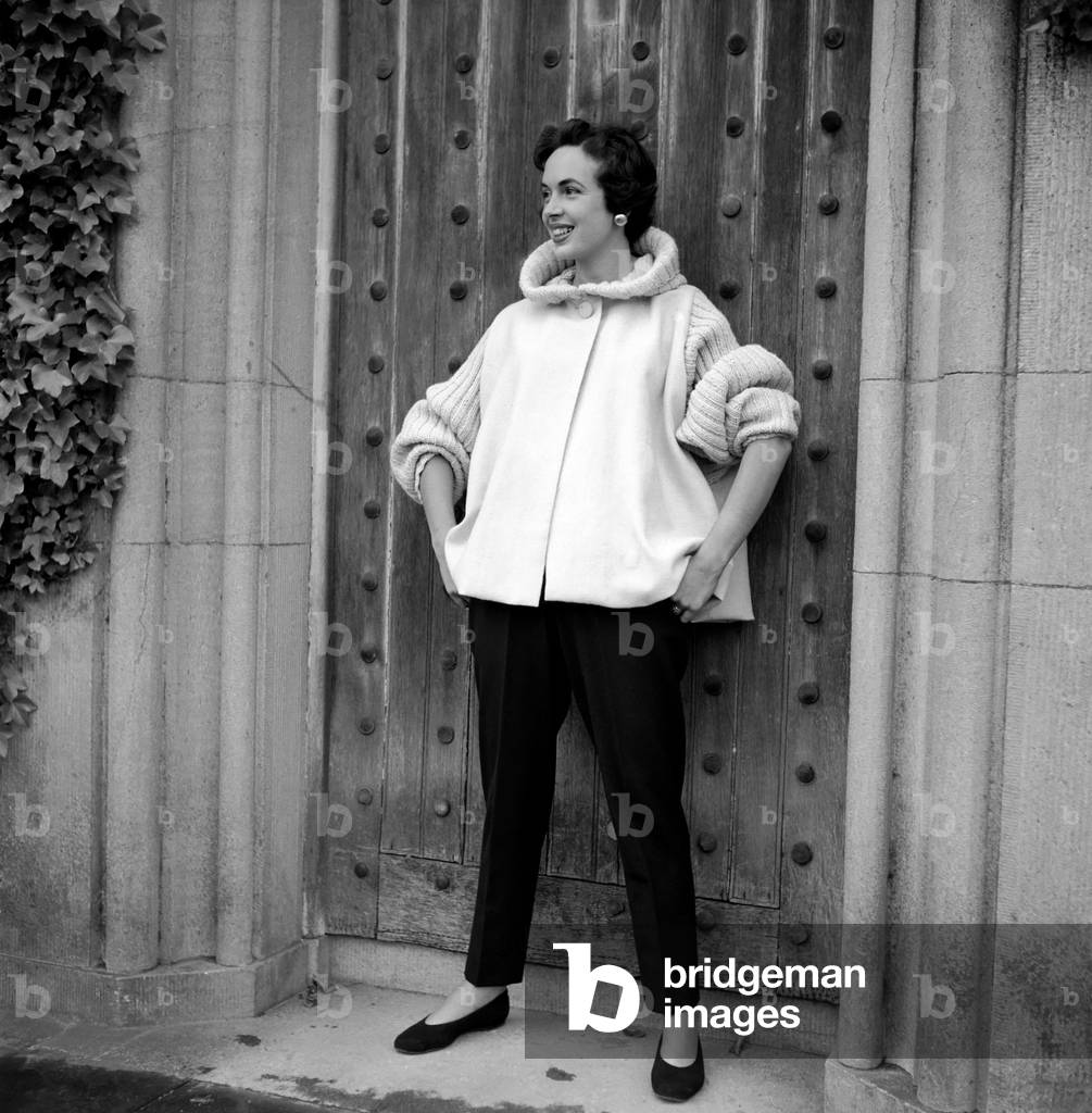 Marla Scarafia modelling knitwear at Sybil Connally. 
July 1953