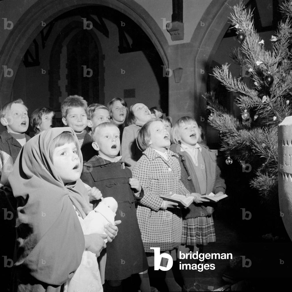 German refugee children sing carols at Christmas time. December 1961