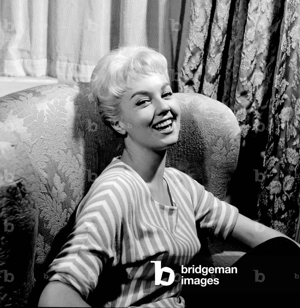 French film actress Mylene Demongeot at Dorchester Hotel, London, October 1957 (b/w photo)