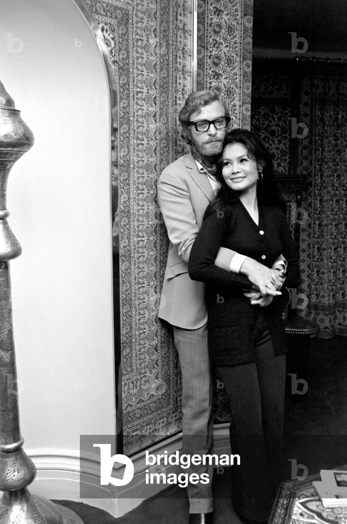 Actor Michael Caine pictured at his home in Grosvenor Square, also pictured is girlfriend Minda Feliciano from the Philippines. November 1969 Z11244