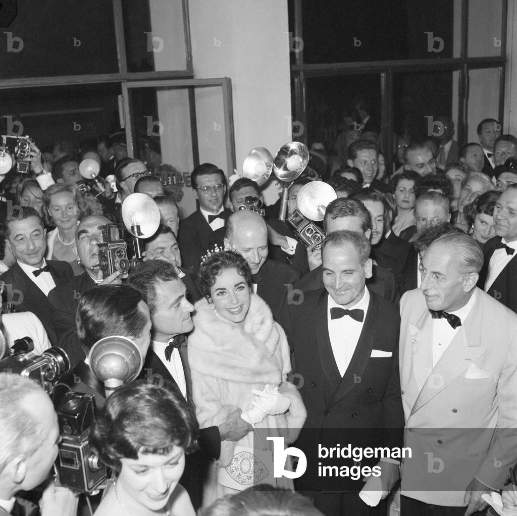 Elizabeth Taylor and husband, film producer Mike Todd, pictured on opening night of the Cannes Film Festival 1957, where his is promoting new film Around the World in 80 Days. Cannes, France, 6th May 1957.