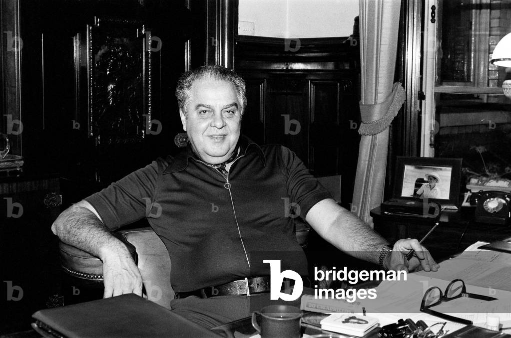 Cubby Broccoli, American film producer, pictured at his London Office Suite, 18th September 1975 (b/w photo)