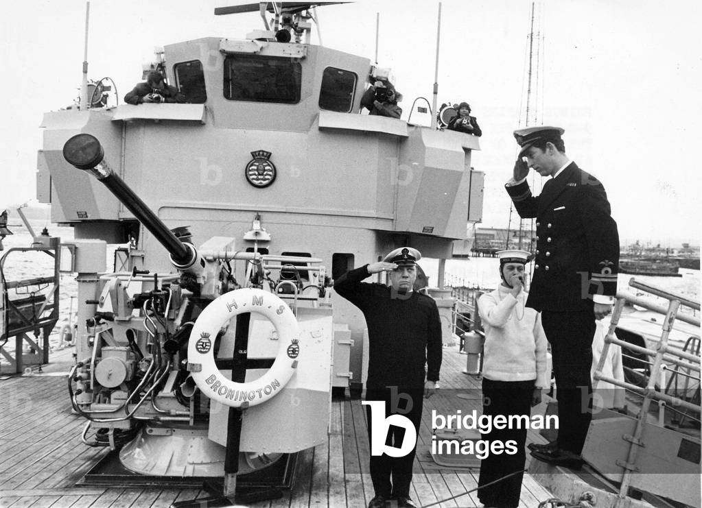 Prince Charles, The Prince of Wales on board HMS Bronington - he salutes as he is piped aboard, 09/02/1976