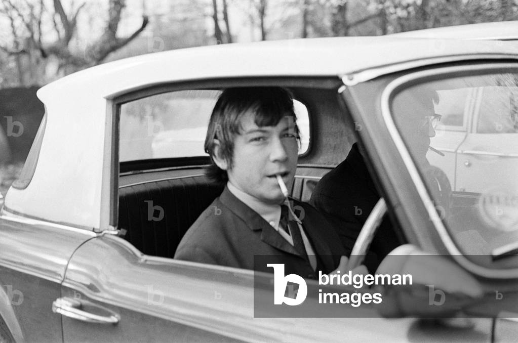 Eric Burdon, lead singer of British rock group The Animals at Uxbridge Court where he was fined £200. here he is pictured leaving in his car after the court case. 1st November 1965 (b/w photo)