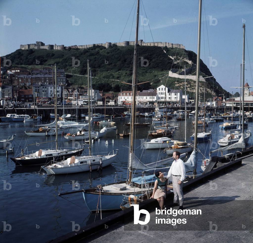 An view of the harbour in Scarborough, Yorkshire showing Castle Hill behind, February 1969.
