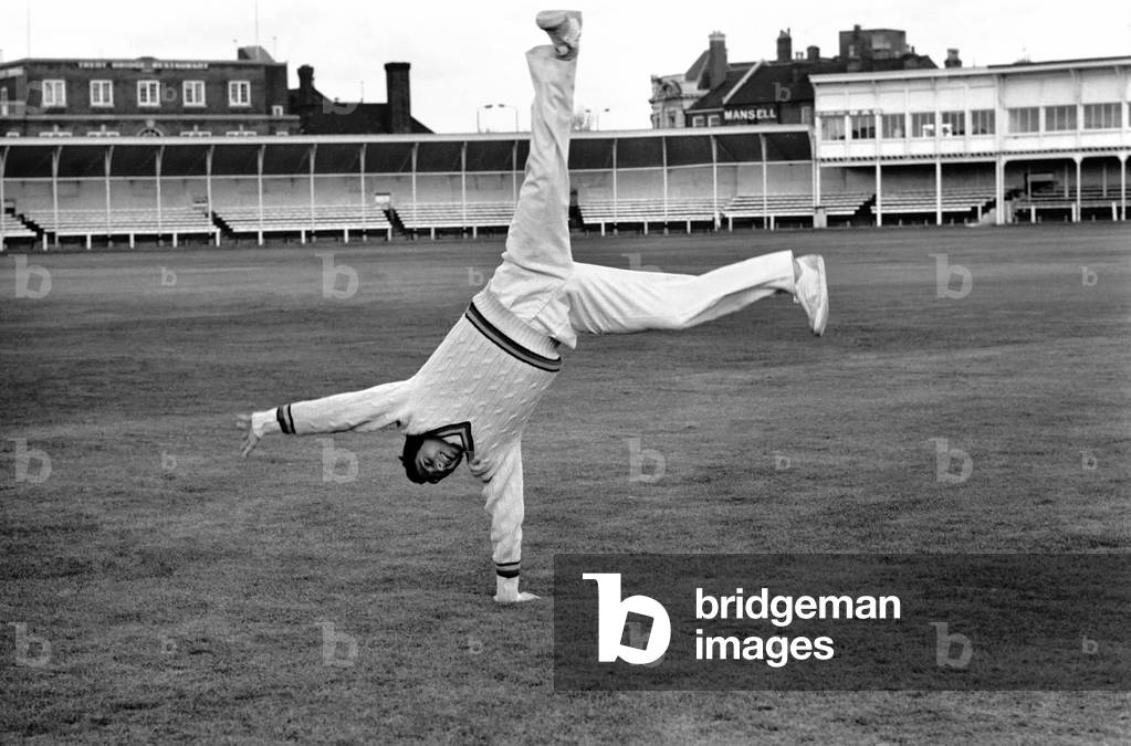 Cricketer Derek Randall and his repertoire of tricks photographed at Trent Bridge as he prepares for the new season. The hands stand, April 1977 (b/w photo)