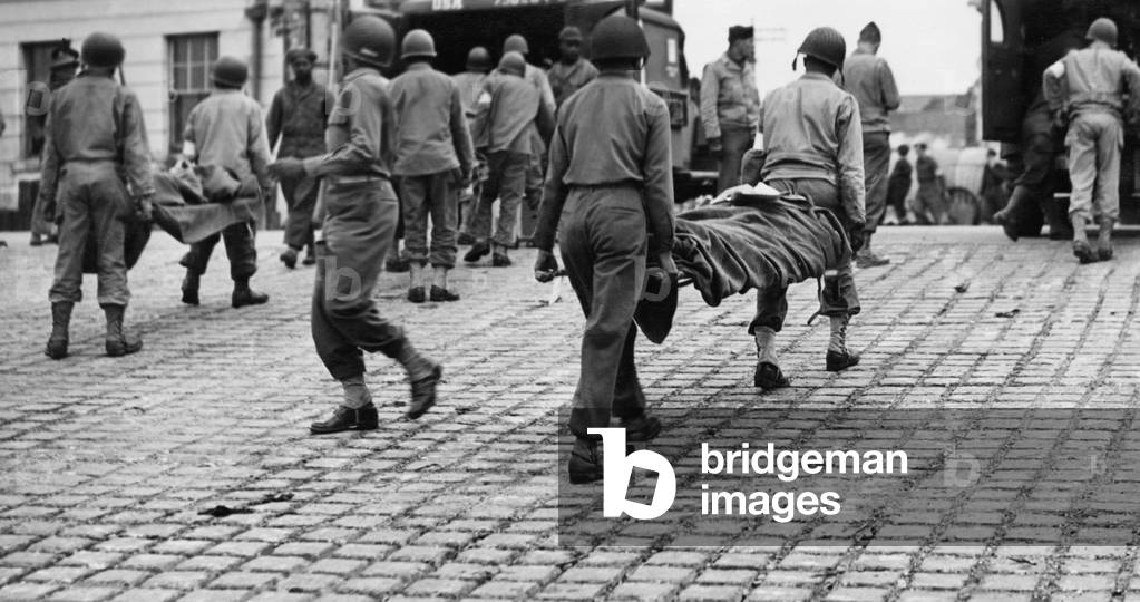 American wounded from the Normandy beach heads seen here arriving at a undisclosed British port on the South Coast 9th June 1944 (b/w photo)