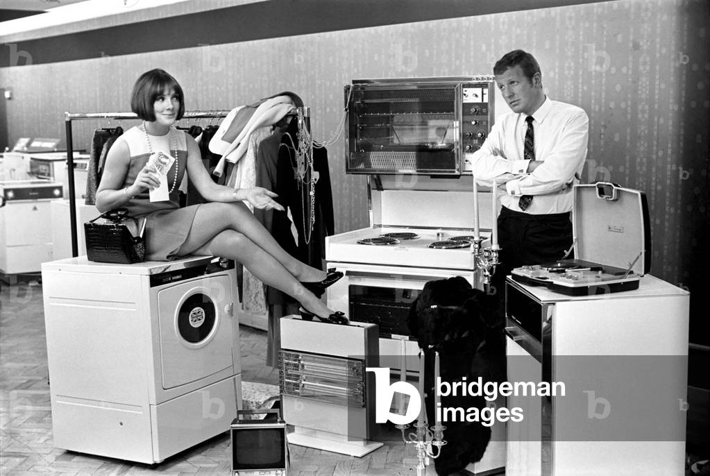A man a woman living in a sububan area of Manchester at home. November 1969