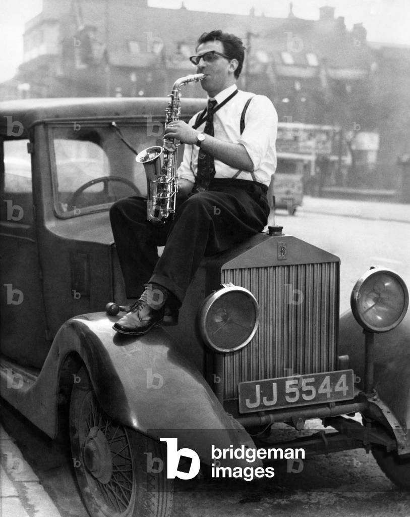 Johnny Roadhouse in Court. Johnny Roadhouse lead saxophone player with the B.B.C. Northern Dance Orchestra, who appeared before the Manchester Magistrate Court today on a charged connected with his 30 y/o Rolls Royce, March 1960