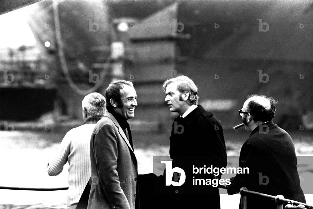 Michael Caine in a scene from the film Get Carter. Hebburn-Wallsend ferry landing with fellow actor Ian Hendry on 1st June 1970 (b/w photo)
