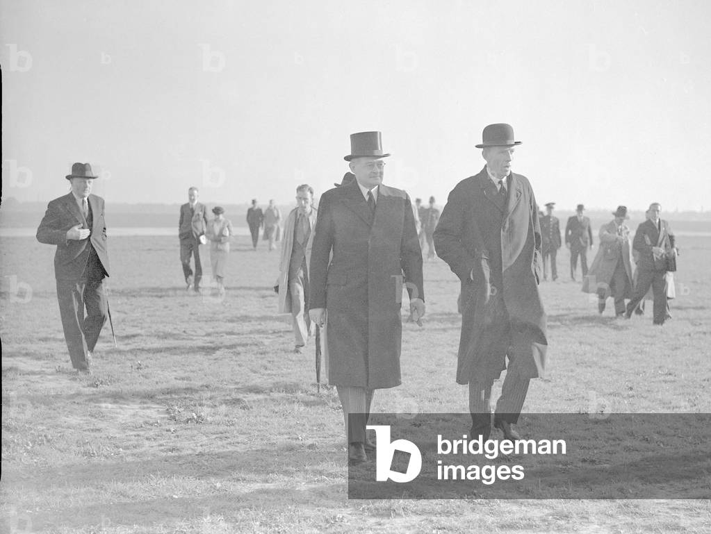 Foreign Secretary Lord Halifax (right) with a German embassy official at Heston airfield before the departure of British prime minister Neville Chamberlain for talks with Adolf Hitler in Munich, 15th September 1938 (b/w photo)