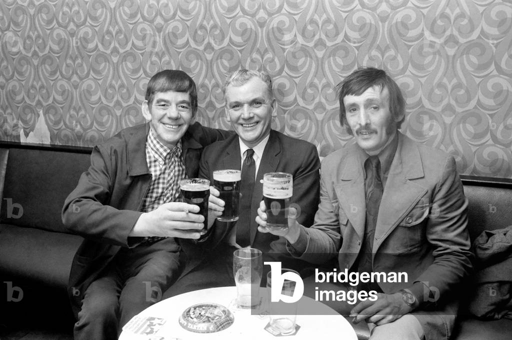 Miners celebrate their pay rise with a drink., February 1975