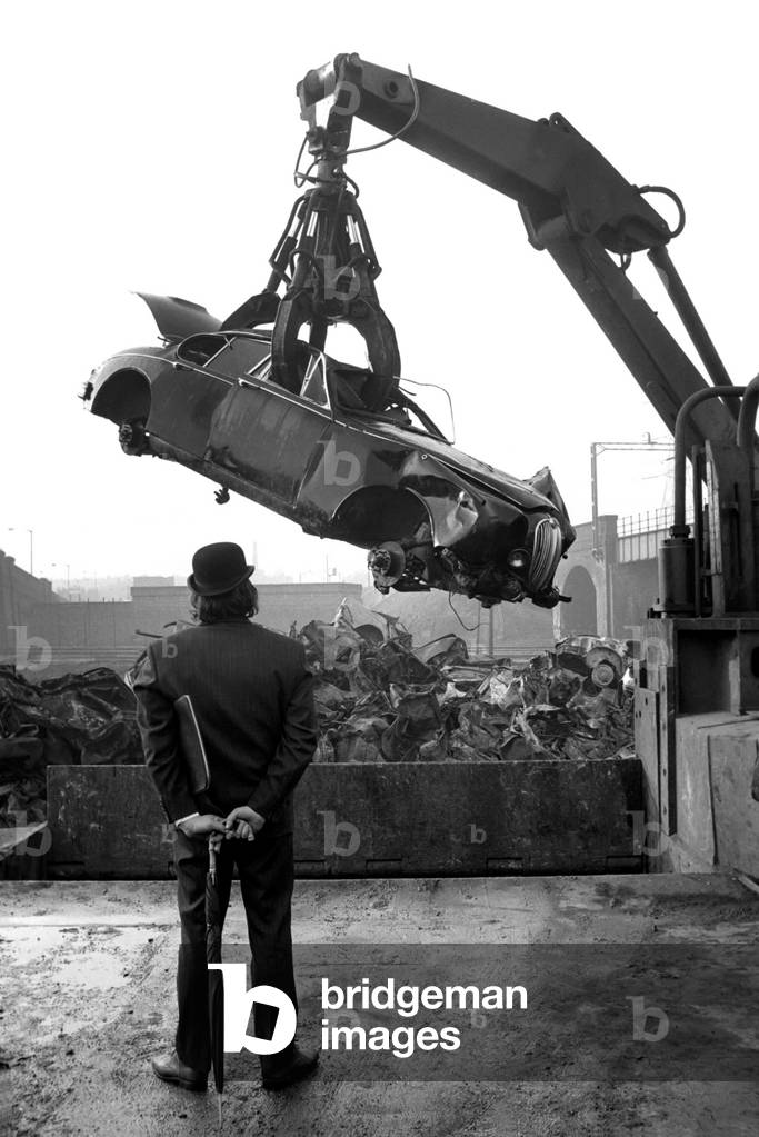 Man Scraps Jaguar Car: On the other hand, Sales Director Mr. Graham Parkes, who says he can no longer afford to run his 15 mile per gallon Jaguar, and was disgusted at dealers' offers, decided to watch its destruction, February 1975