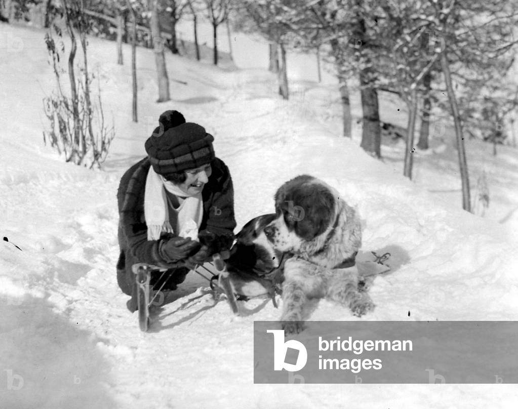 A fair luger with a St Bernard dog at Murren,Switzerland 1922