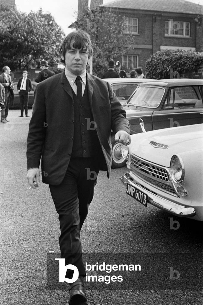 Eric Burdon, lead singer of British rock group The Animals at Uxbridge Court where he was fined £200. here he is pictured leaving after the court case. 1st November 1965 (b/w photo)