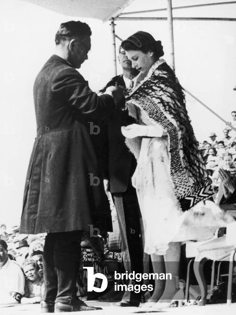 The Queen has a Maori cloak placed around her shoulders by the bishop of Aotearoa in Rotorua, New Zealand.
11th Jan 1954