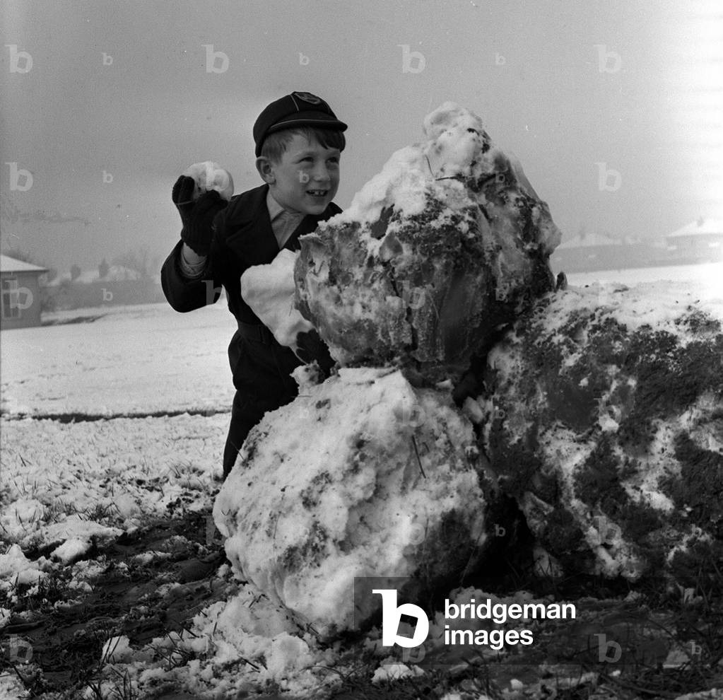Child Playing in the snow, December 1961 (b/w photo)
