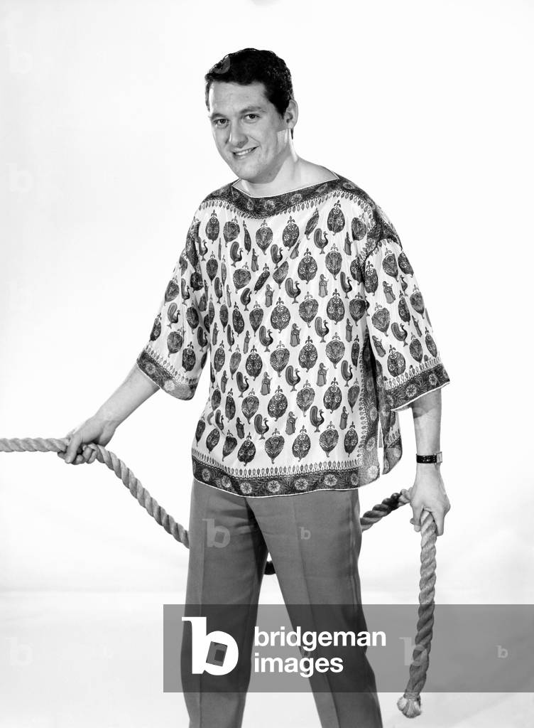 Clothing: Fashion: Menswear: Man wearing silk shirt. Model: Michael Lester. 1964 (b/w photo)