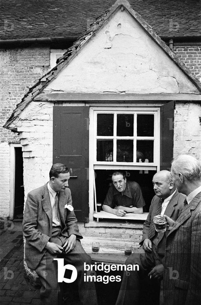 A group of men enjoy a game of Bat and Trap at a pub in Kent. Bat and trap is an English bat-and-ball pub game. It is still played in Kent, and occasionally in Brighton. August 1947 (b/w photo)