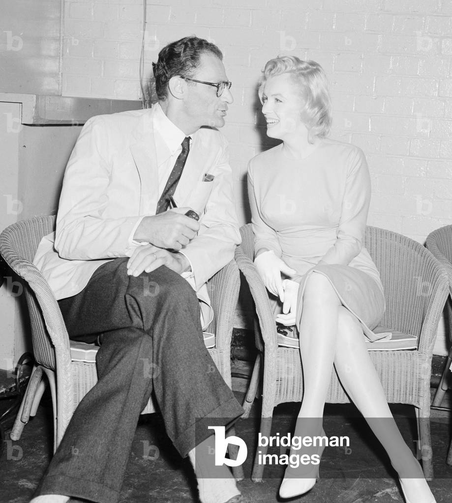 Actress Marilyn Monroe and playwright husband Arthur Miller seen here at London Airport. 14 July 1956 (b/w photo)
