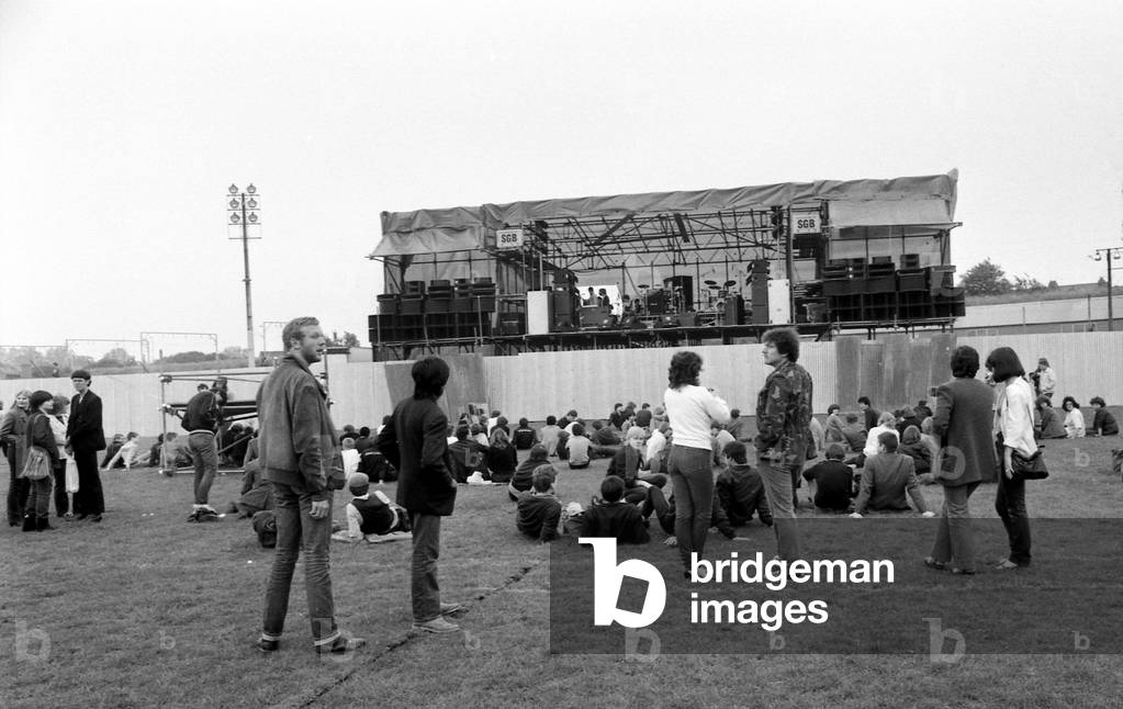 Hazel O'Connor and The Specials performed on stage at the outdoor concert in aid of racial harmony at The Butts stadium in Coventry, 22nd June 1981 (b/w photo)