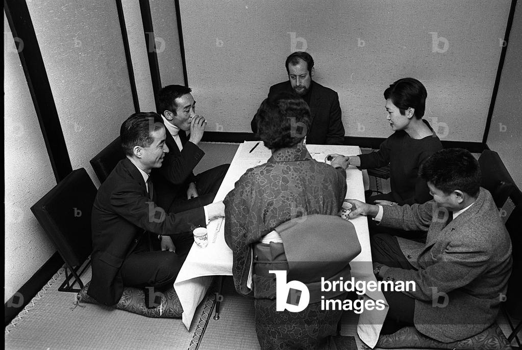 Clement Freud dining with Mitsonori Seki, c, 1968 (b/w photo)