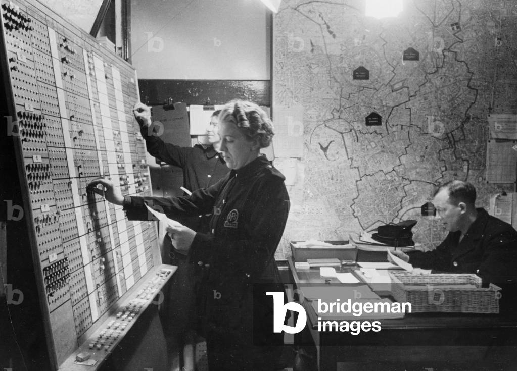 Control room of a Superintendant Station. Push buttons are used as fire appliances are sent off to jobs, 17th October 1940