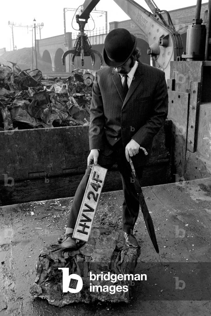 Man Scraps Jaguar Car: On the other hand, Sales Director Mr. Graham Parkes, who says he can no longer afford to run his 15 mile per gallon Jaguar, and was disgusted at dealers' offers, decided to watch its destruction, February 1975