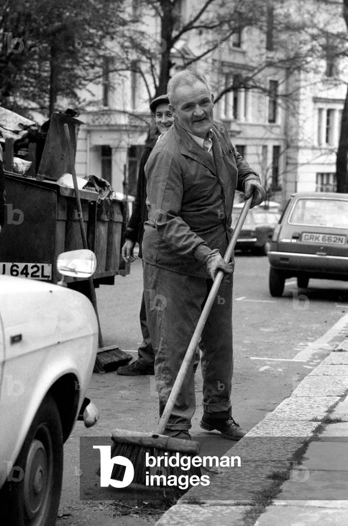 Is work wonderful?. Feature. At work in Notting hill Gate West London road-sweeper John Faulknar aged 58 who lives in Kensington, April 1977 (b/w photo)