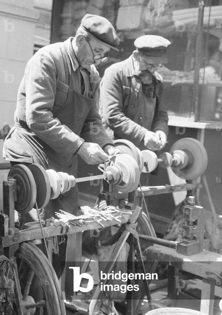 Sharpners seen here sharpening scissors on the streets of Kiev, Ukraine, USSR. May 1960