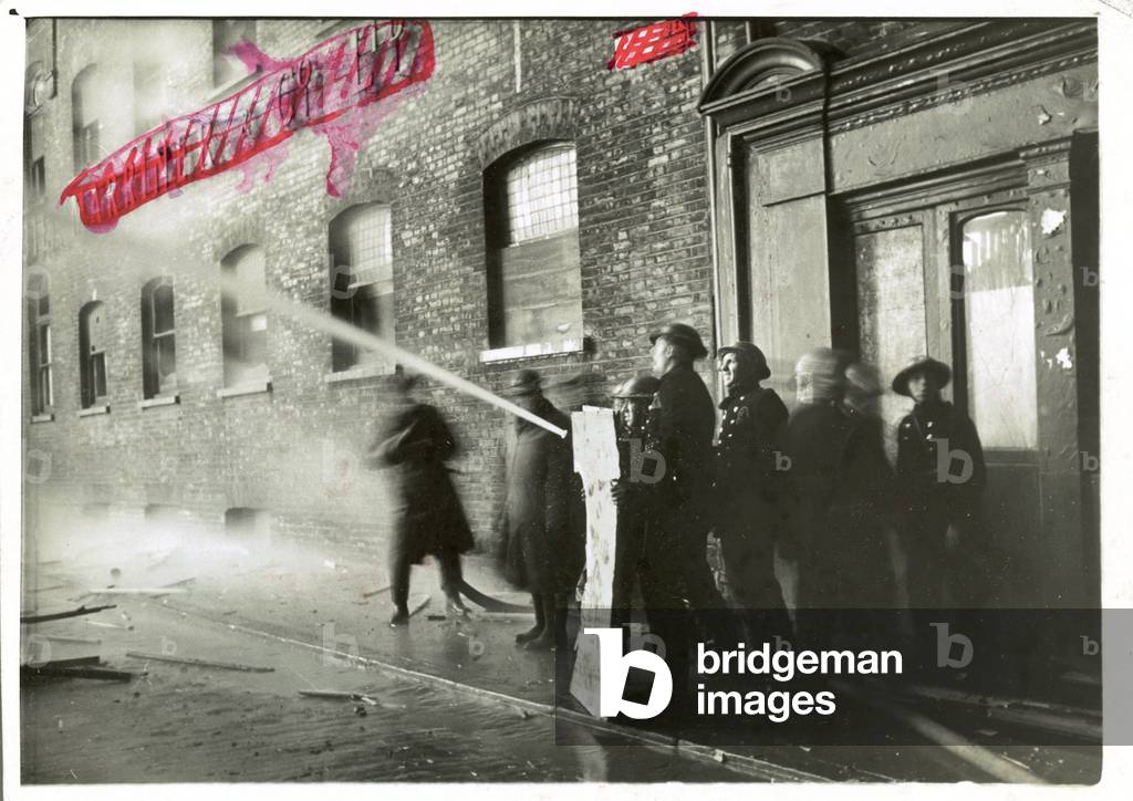 London suffered its second fire blitz last night - our picture shows the fire fighters at work during the blitz. MOI dated 12th January 1941 (b/w photo)