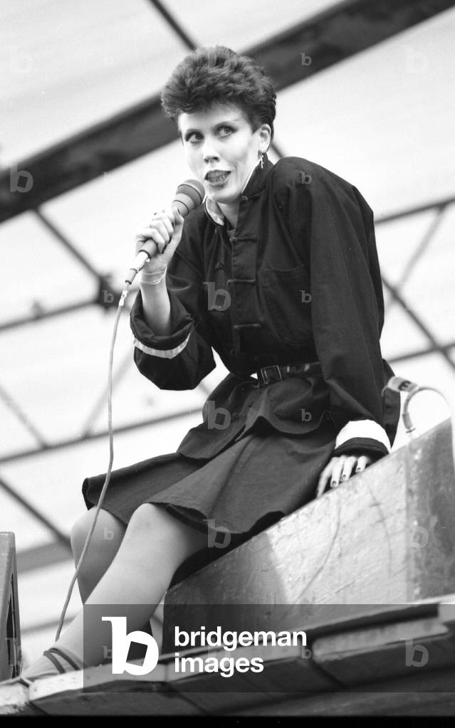 Hazel O'Connor performs on stage at the outdoor concert in aid of racial harmony at The Butts stadium in Coventry, 22nd June 1981 (b/w photo)