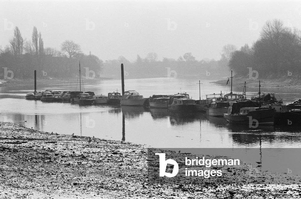 Boats on the River Thames in Kew, London. 5th March 1971 (b/w photo)
