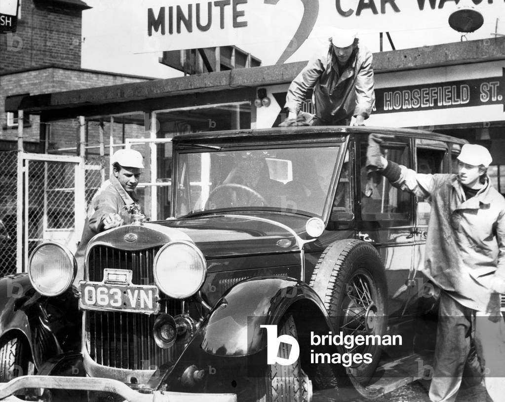 1928 Lincoln Limousine owned by My Ayrton of Marske, gets a wash and polish from the 'Wash and Brush Up' Boys, Two Minute Car Wash, Middlesbrough, 16th April 1964 (b/w photo)