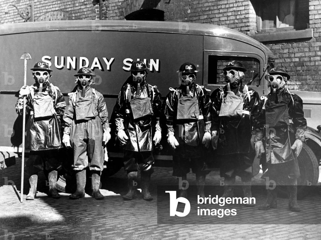 Newcastle Chronicle and Journal staff wearing gas masks as part of air raid precautions (A R P) training. Air Raid Wardens, c. 1940 (b/w photo)