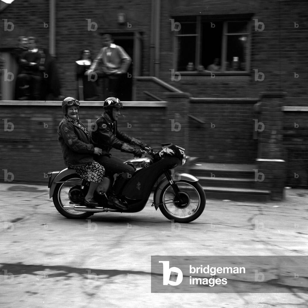 With her crash helmet on fair and square, and goggles flipped back, 80 year old 