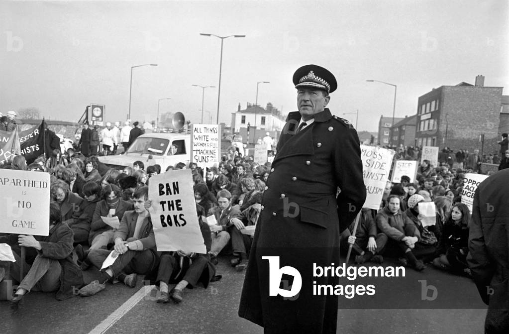 Police arrest protesting students in Talbot Road behind White City, who have gathered in a demonstration against the visit of the South African rugby team and the apartheid system. November 1969