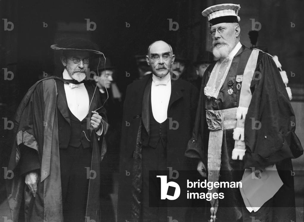 The ceremony, arranged by Council of the University of Paris, to confer the degree of Doctor honoris causa on poet and author Mr. Rudyard Kipling (centre) and Sir James G. Frazer, author of The Golden Bough as eminent friends of France. Pictured on the right is Monsieur Appell, the Rector of the Sorbonne where the ceremony took place. 18th November 1921 (b/w photo)