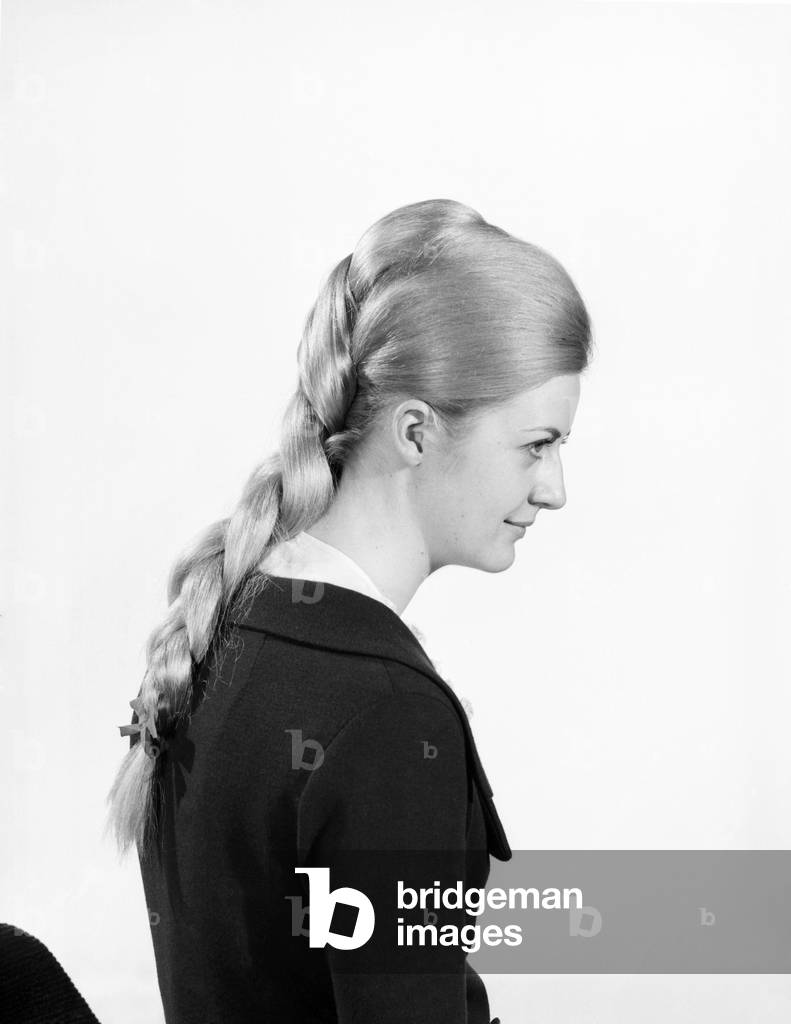 Woman at the beauty department of Selfridges store having a Tovar- tress attached to her hair, 1966 (b/w photo)