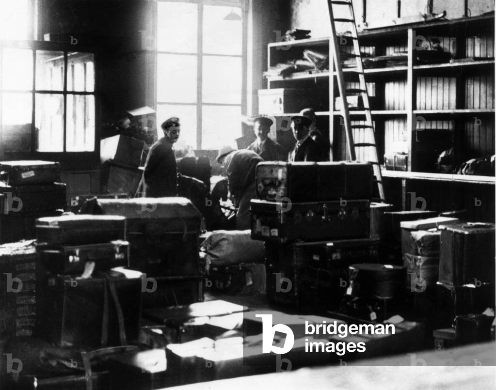 William Joseph Vinnicombe at the left luggage office of Brighton railway station, 17th June 1934 (b/w photo)